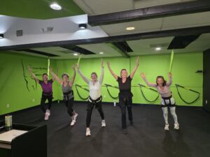 This is a photo of a Private Group Class at 4Fitness 5 women hooked up to Bungees